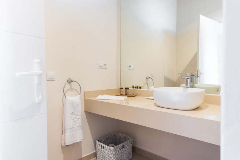 Tenerife film tv photoshoot locations period 1960s bathroom restroom white tile bath tub washbasin